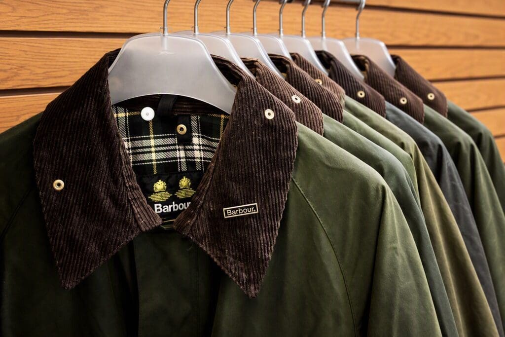 Row of Barbour wax jackets with corduroy collars at The Gun Cupboard